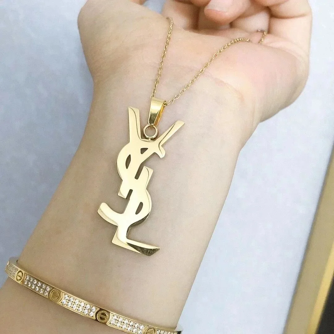 Saint Laurent Yves Saint Laurent Monogram Gold Pendant Necklace Gold