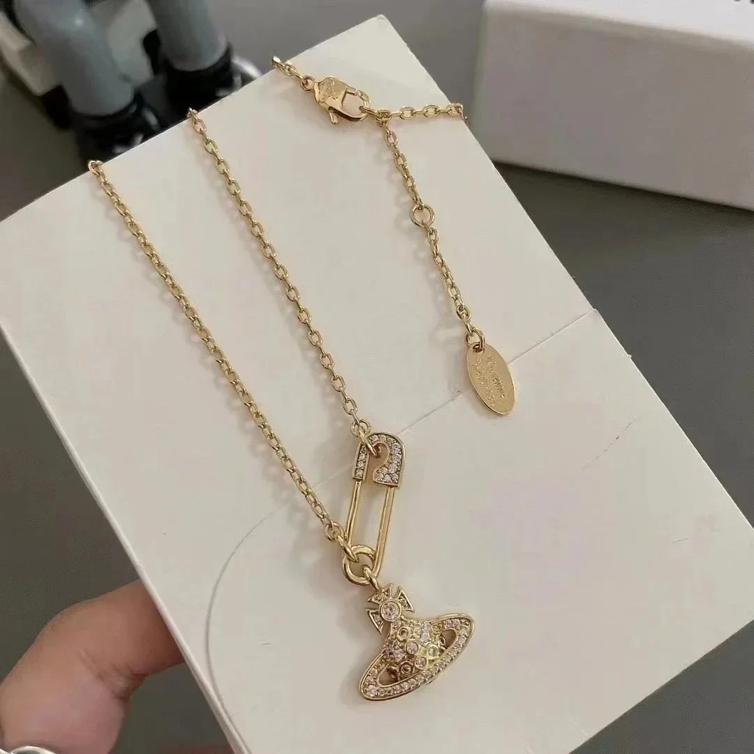 Vivienne Westwood Vivienne Westwood Orb Gold Safety Pin Necklace Gold - 1