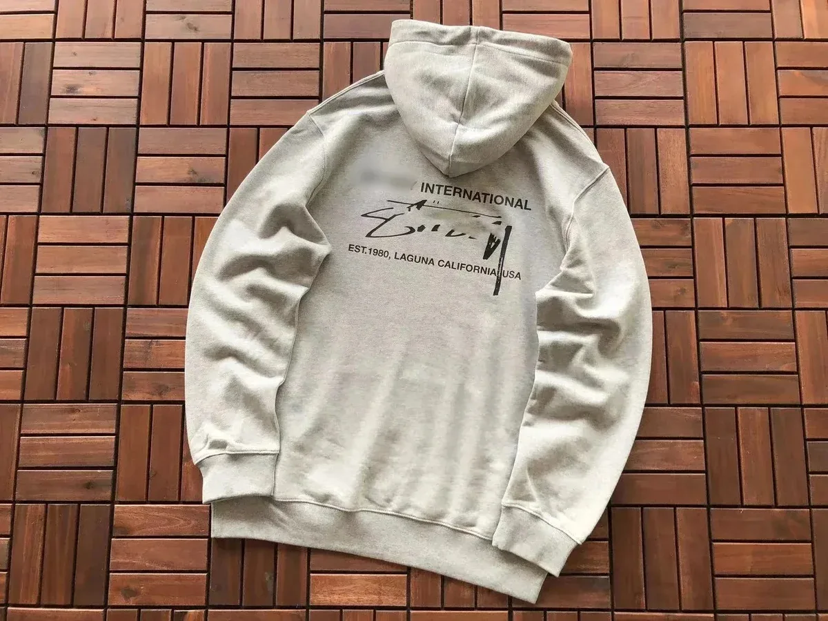 Essentials Unisex Light Grey Hoodie with 'International' Graphic Print Grey - 1
