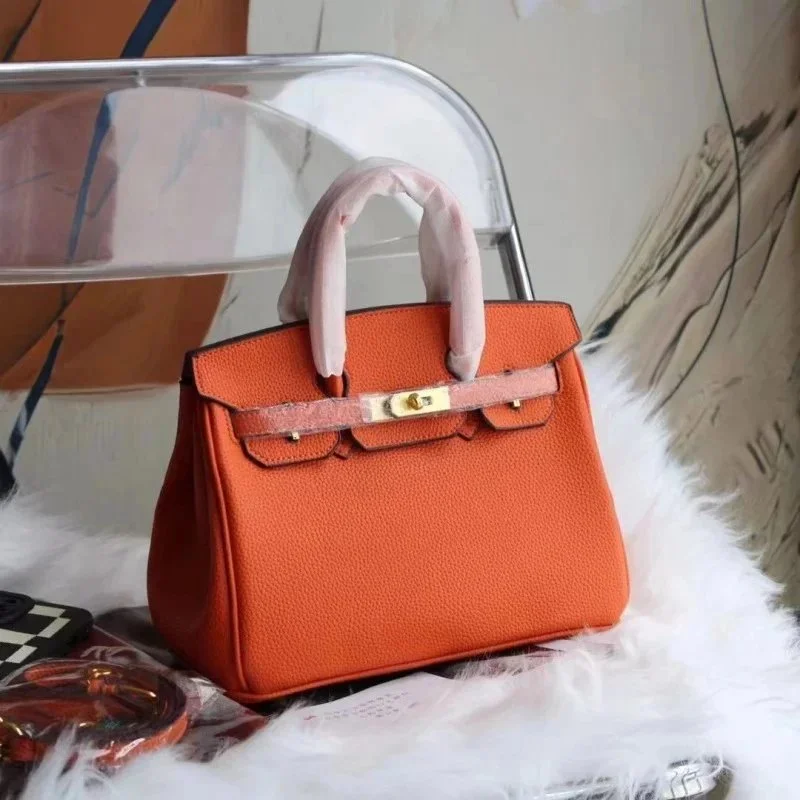 Hermès Birkin Handtasche aus orangefarbenem Kieselleder