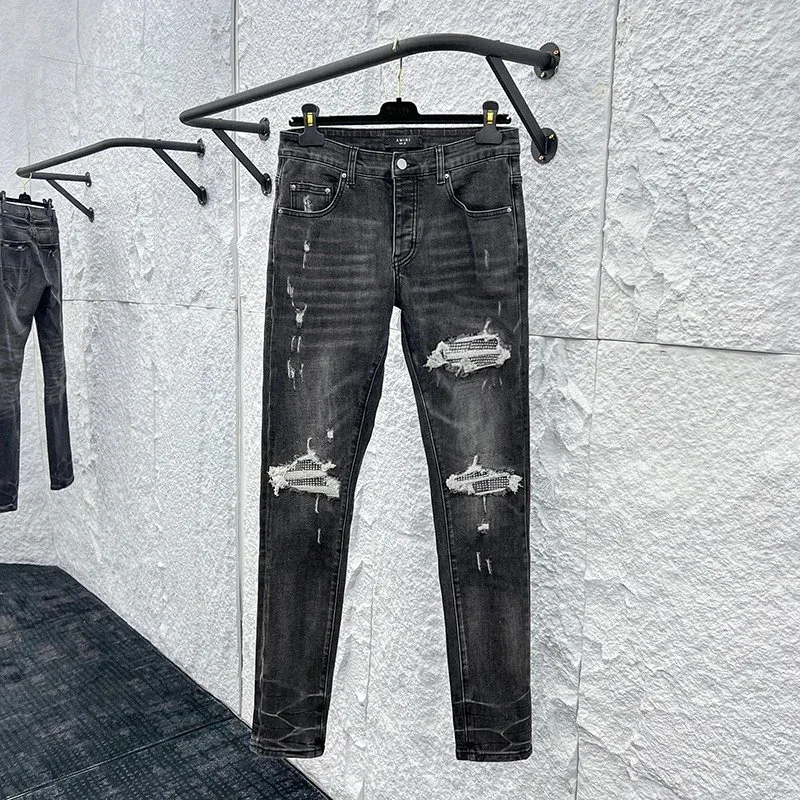Distressed Black Jeans with Rips