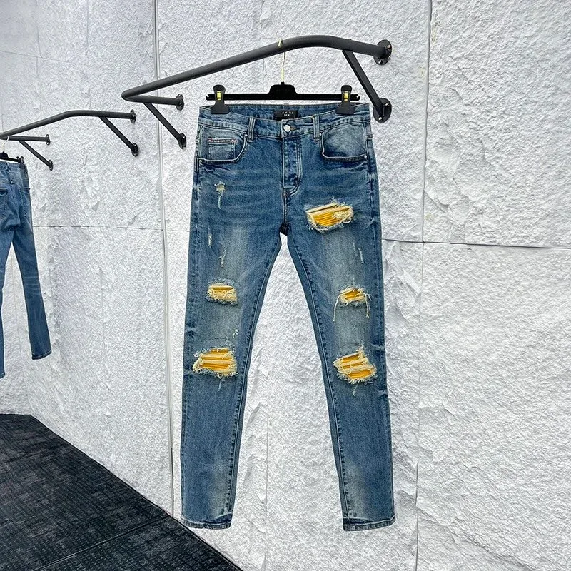 Distressed Denim Jeans with Yellow Patchwork