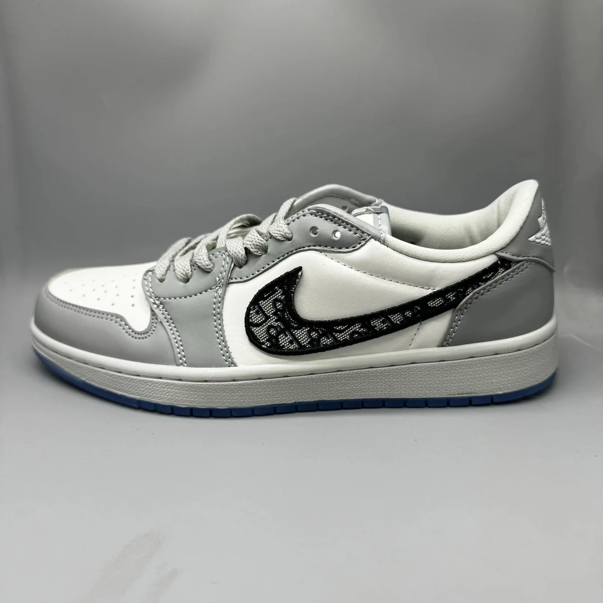 Nike Air Jordan 1 Low Sail/Black Swoosh Sneakers