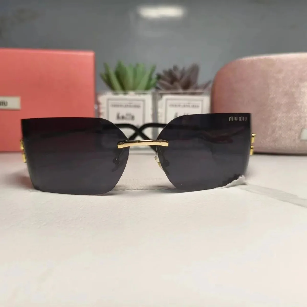Miu Miu Rimless Sunglasses Black Gold Eyewear