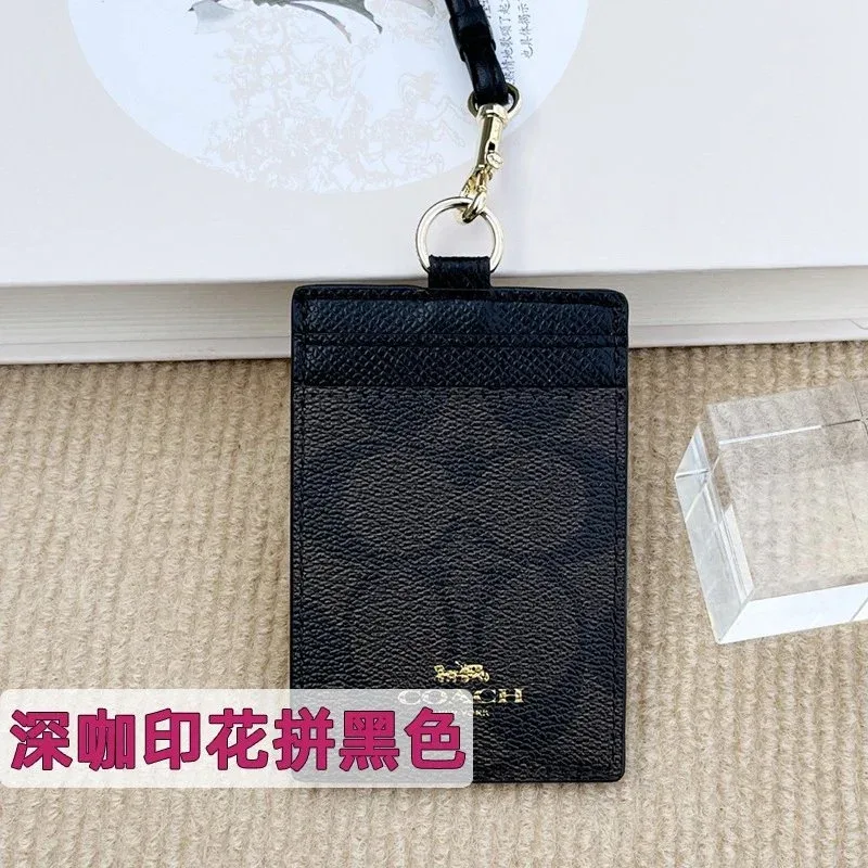 Coach Tabby深咖印花拼黑色Card Holder