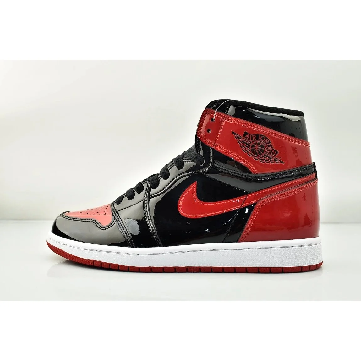 Nike Air Jordan 1 Bred Patent Leather Sneakers