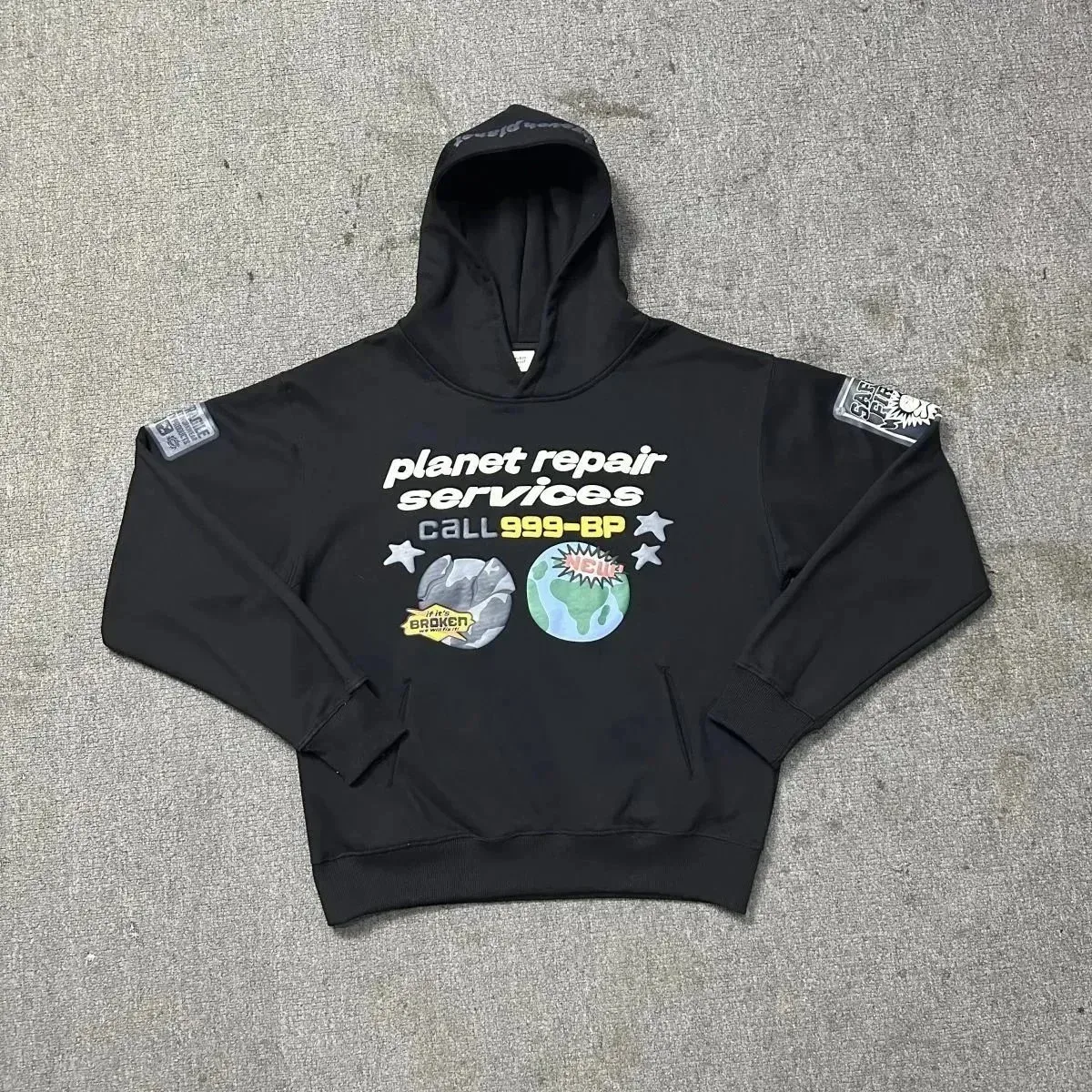 Black 'Planet Repair Services' Hoodie