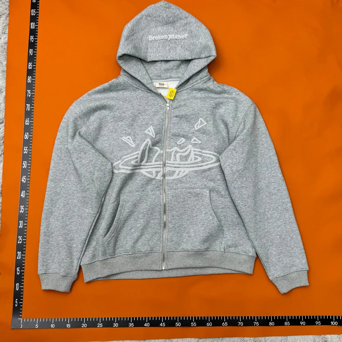 Broken Planet Market Grey Hoodie with Embroidered Graphic