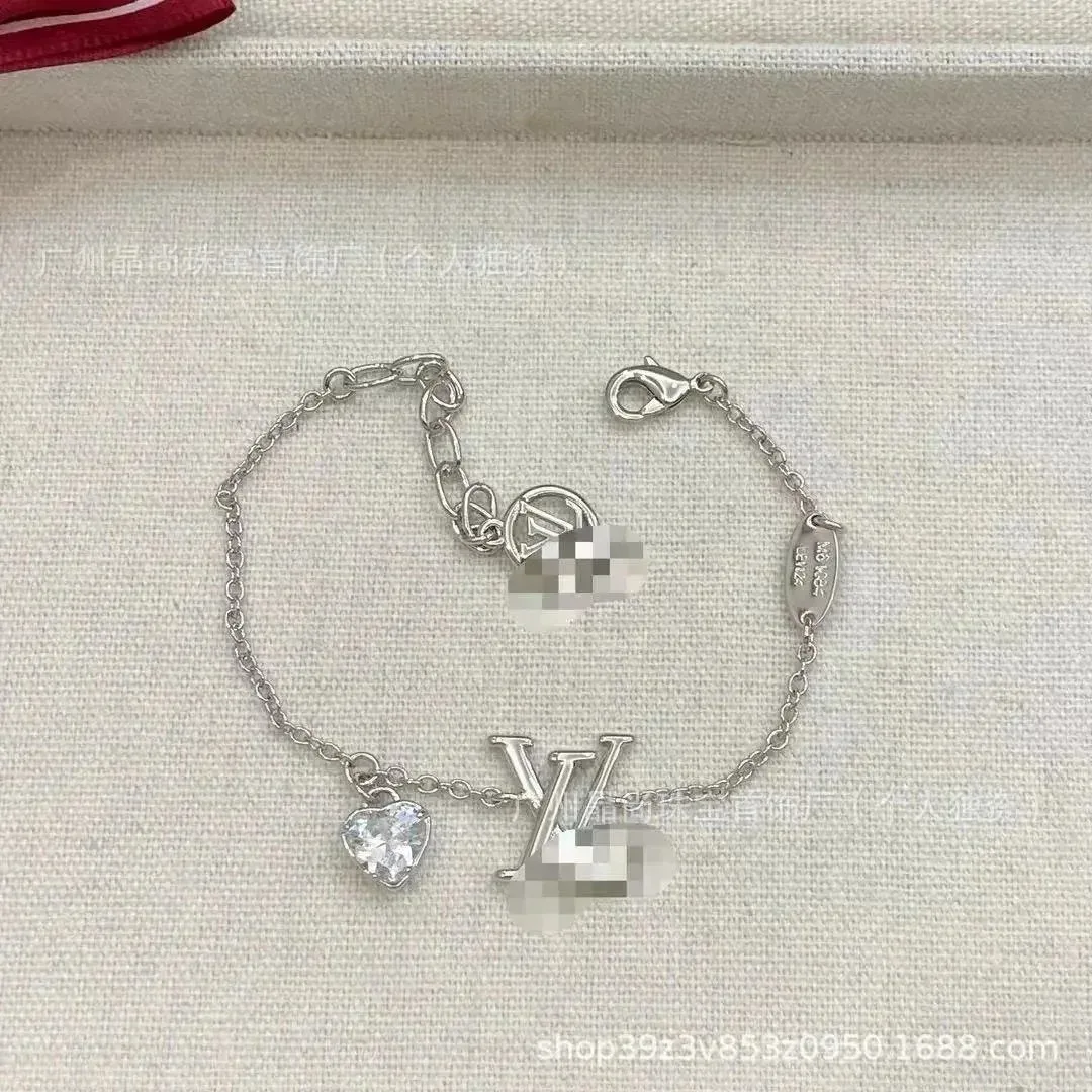 Louis Vuitton Tabi LV Logo Heart Charm Bracelet Silver