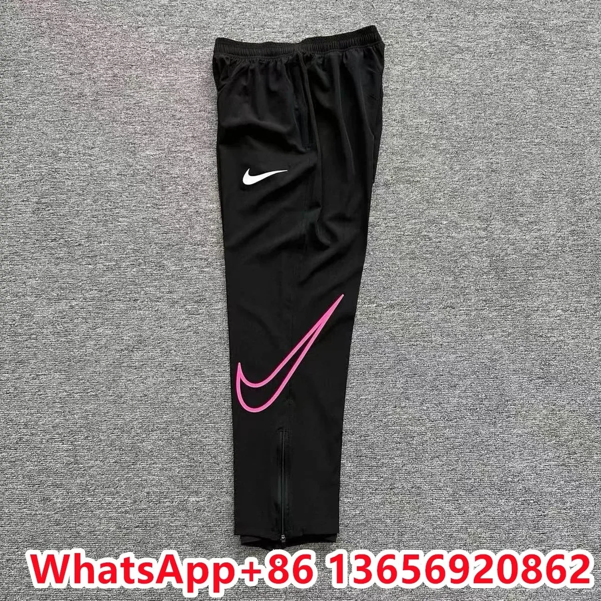 Nike粉空钩运动裤