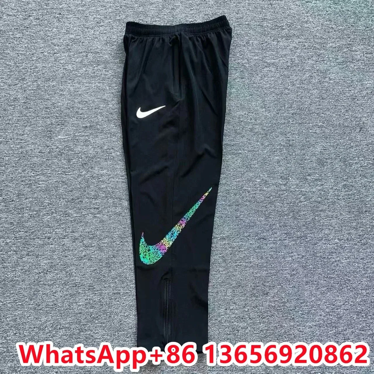 Nike反光彩线圈钩运动裤