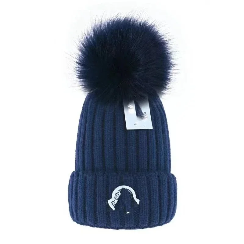 Maison Mihara Yasuhiro Maison Mihara Yasuhiro MMY Blakey Navy Pom Beanie Navy - 1