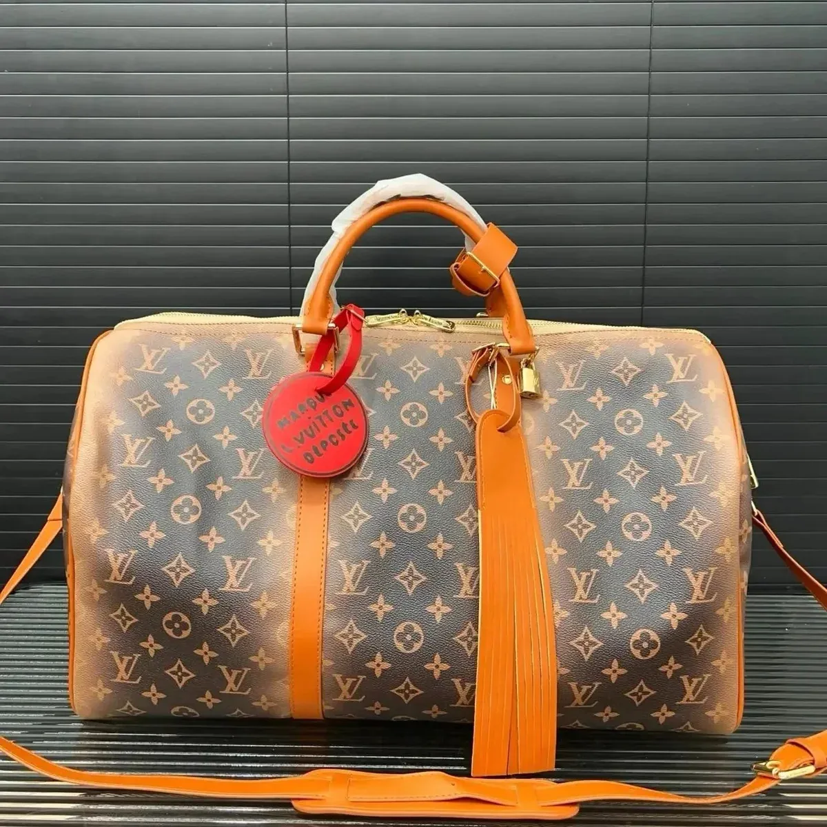Louis Vuitton Louis Vuitton Keepall Monogram Brown/Orange Duffel Bag Brown