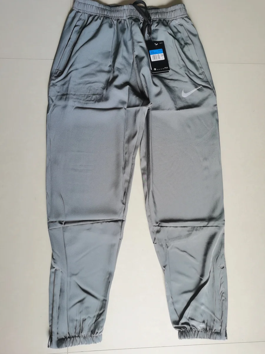 Nike Nike Cuffed Grey Track Pants - Lightweight Sporty Bottoms Grey